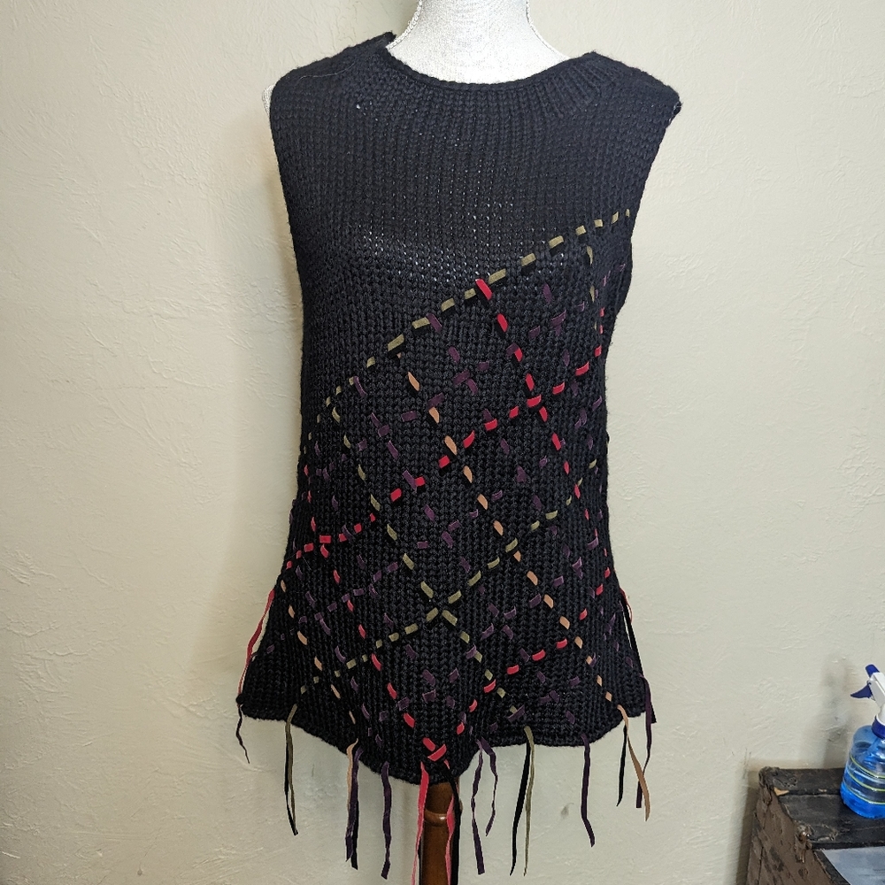Simon Chang Black Sleeveless Sweater with Criss Cross Detailing.